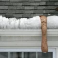 Socks filled with ice melt (NOT rock salt) can be effective against ice dams.